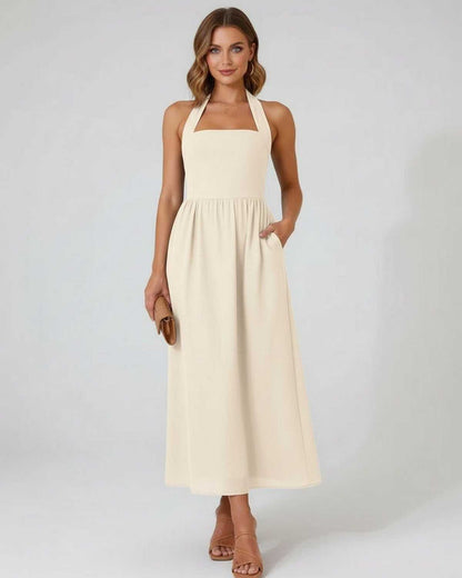 Sahara Midi Dress – Beige Halter A-Line Midi Dress by Lauven, featuring a structured neckline and flowing skirt.