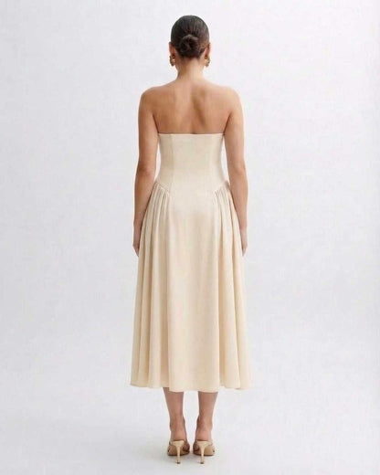 Sahara Midi Dress - Beige strapless dress with pleated skirt, embodying elegance and grace by Lauven.
