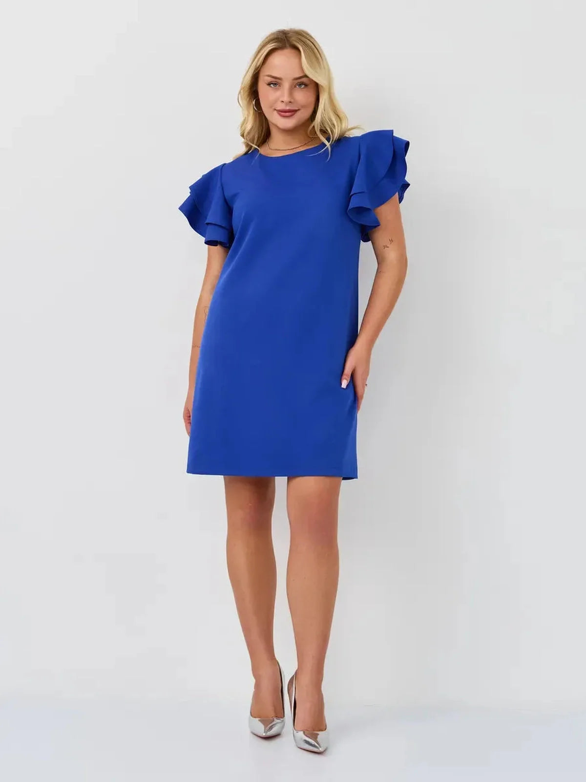 Model showcasing a vibrant sapphire blue mini dress with ruffle sleeves, perfect for summer elegance.