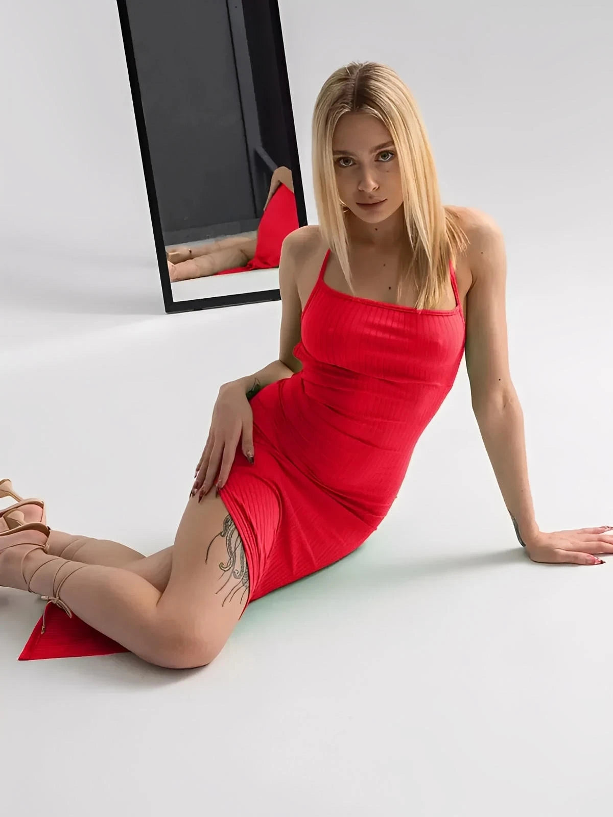 Scarlet Lace Midi Dress in bold red, featuring spaghetti straps, a side slit, and a corset-style back.