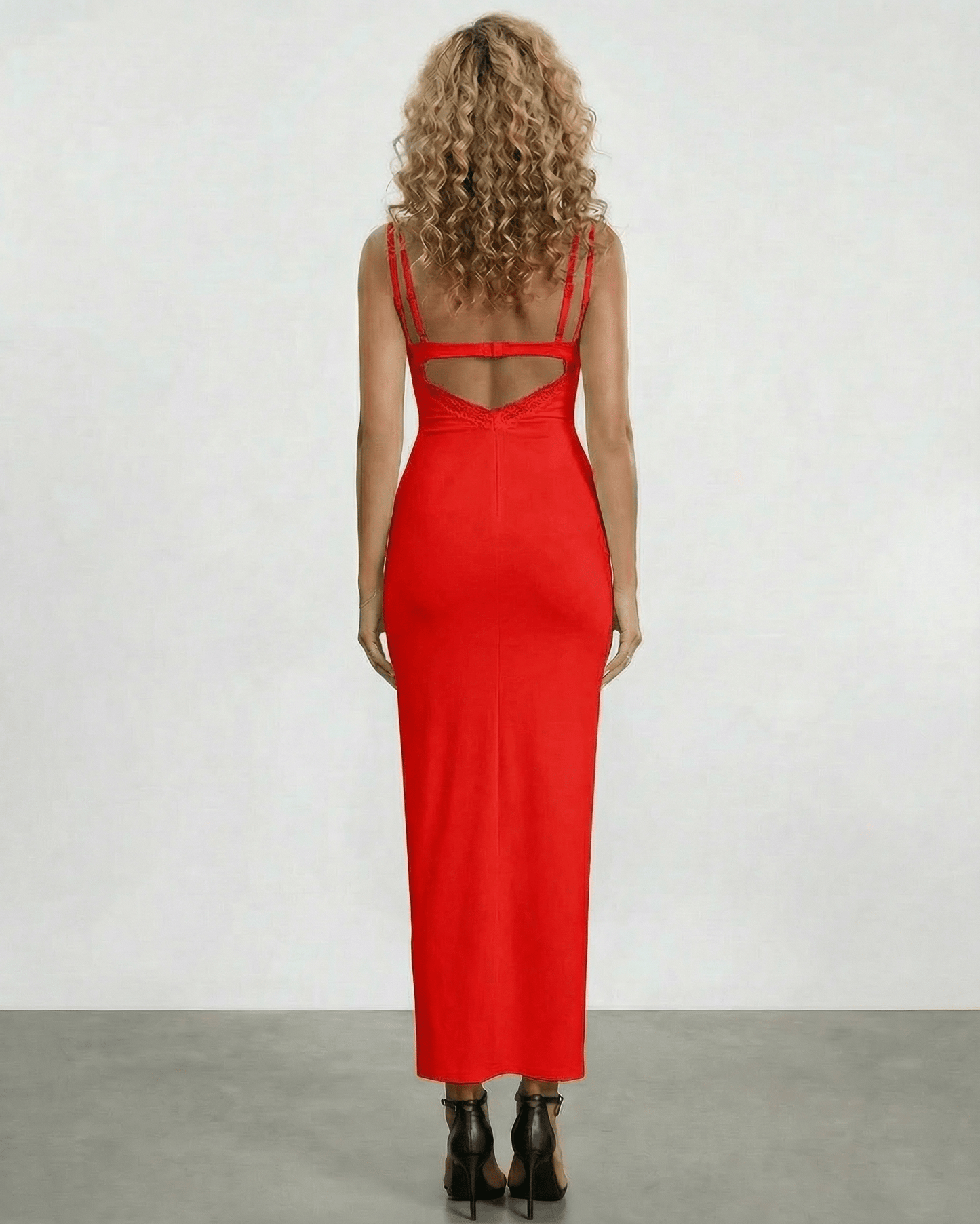 Back view of a woman wearing the Lauven Scarlet Maxi Dress with lace panel detailing and spaghetti straps.