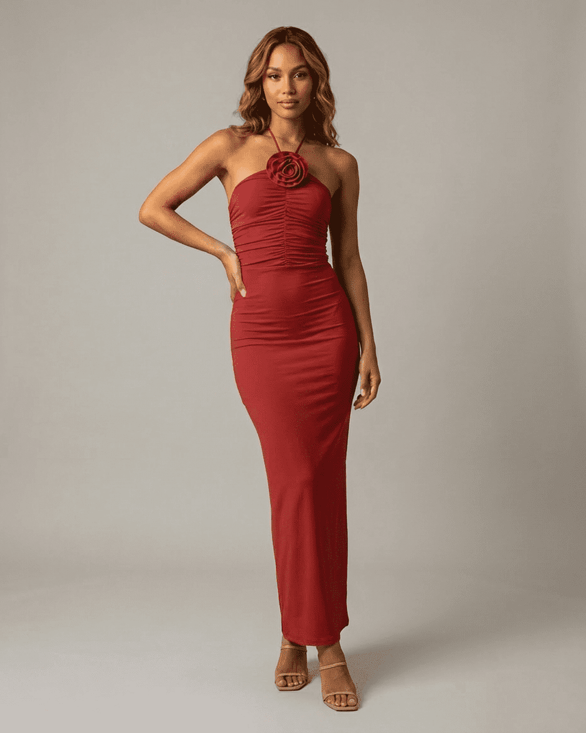 Scarlet Maxi Dress by Lauven, featuring a one-shoulder silhouette and sculptural floral detail in red.