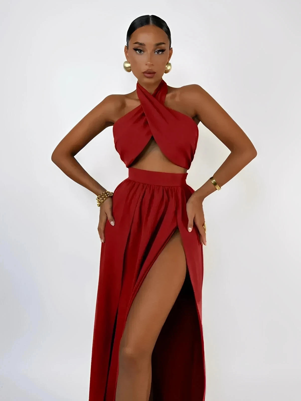 Scarlet Mirage Set featuring a draped halter top and high-waisted slit skirt in vibrant crimson.