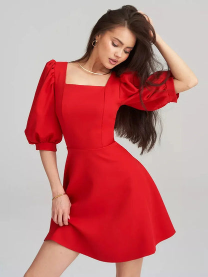 Scarlet Muse Red Mini Dress featuring square neck, puff sleeves, and a flared skirt for a modern elegant look.