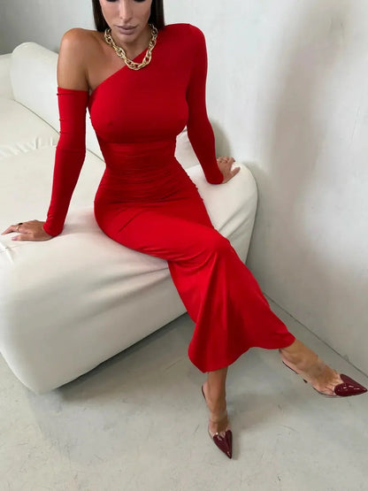Model wearing the Scarlet Sculpt Maxi Dress in bold red, showcasing a one-shoulder neckline and elegant silhouette.