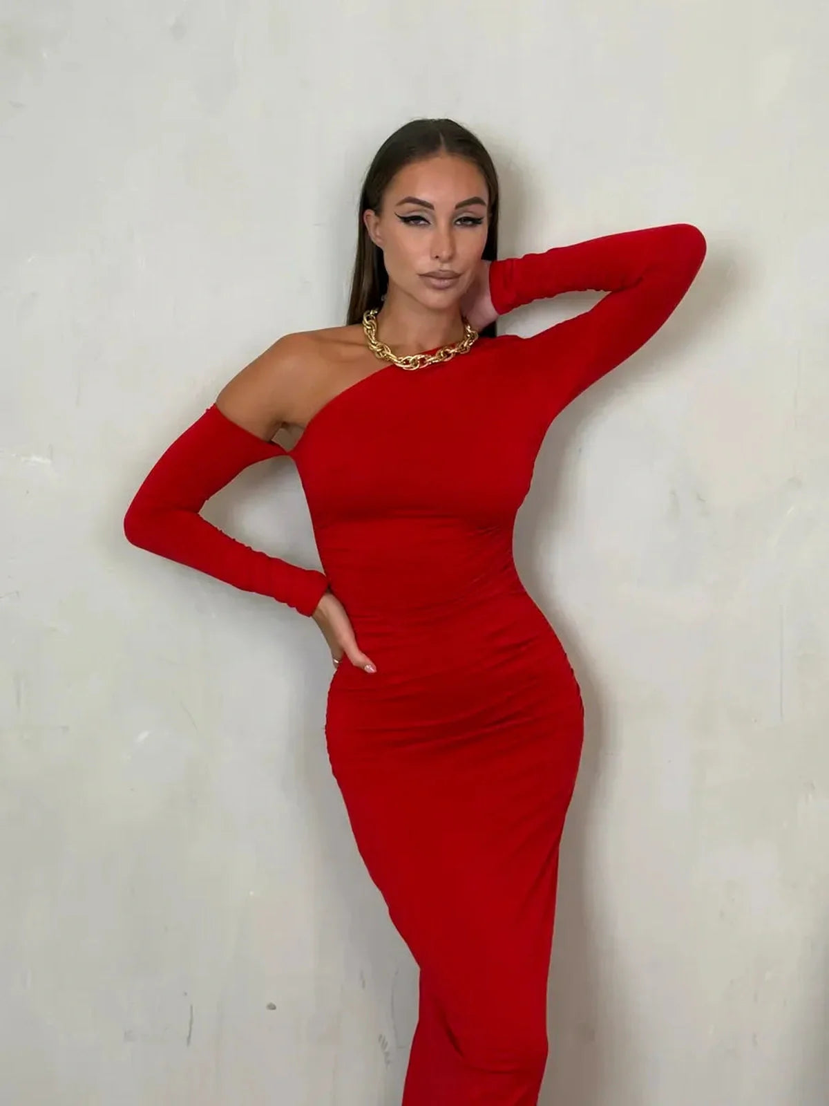 Model wearing the Scarlet Sculpt Maxi Dress featuring a one-shoulder design in bold red, showcasing elegance and sophistication.