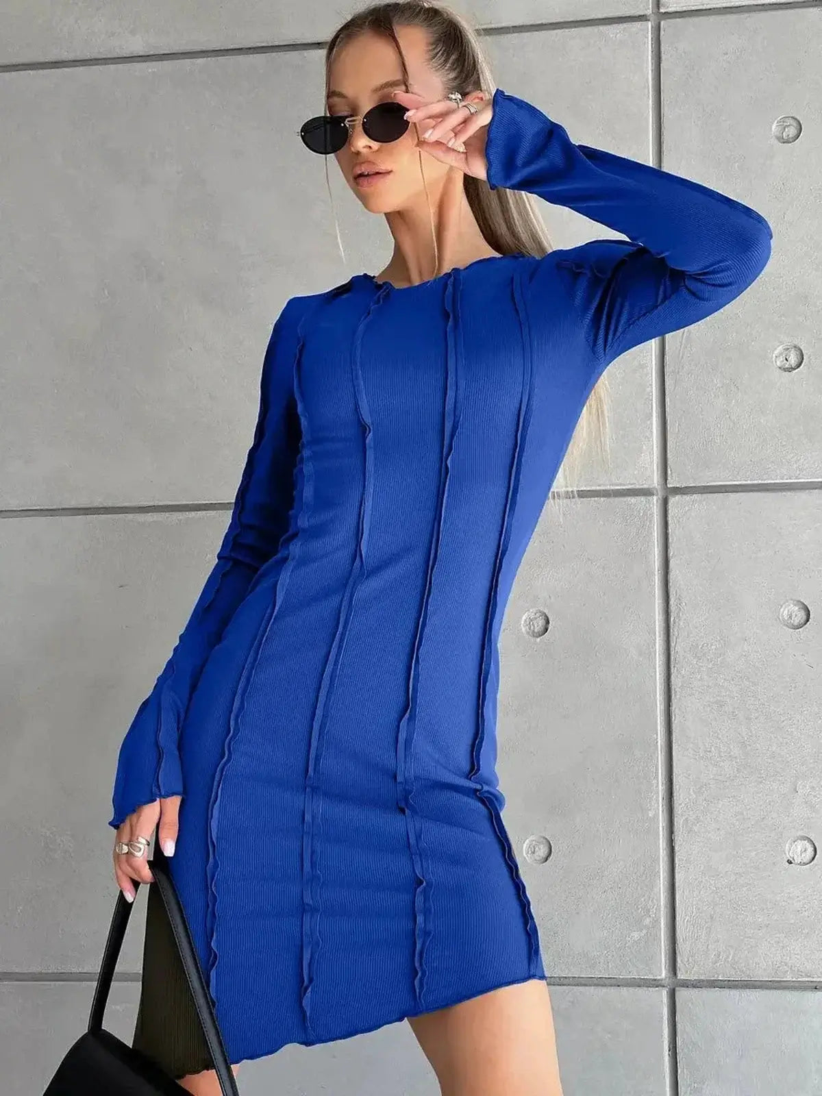 Vibrant blue long sleeve Sculpt Mini dress, featuring precise seamwork and a sleek body-hugging fit.