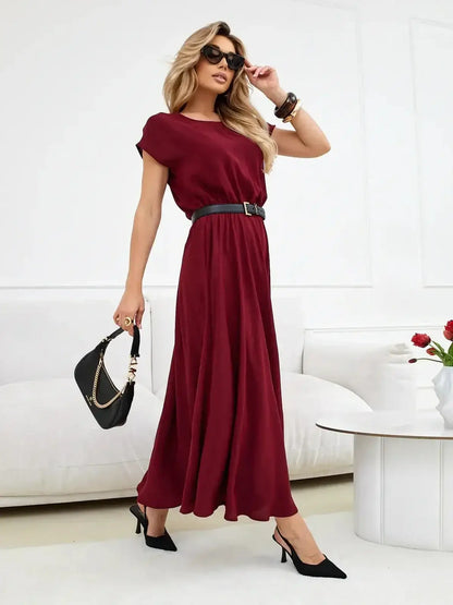 Sculpted Ease Maxi Dress in deep burgundy featuring an airy fit, cinched waist, and flowing skirt, styled for elegance.