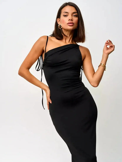 Elegant black maxi dress with convertible straps and ruched bodice, showcasing a sleek silhouette.