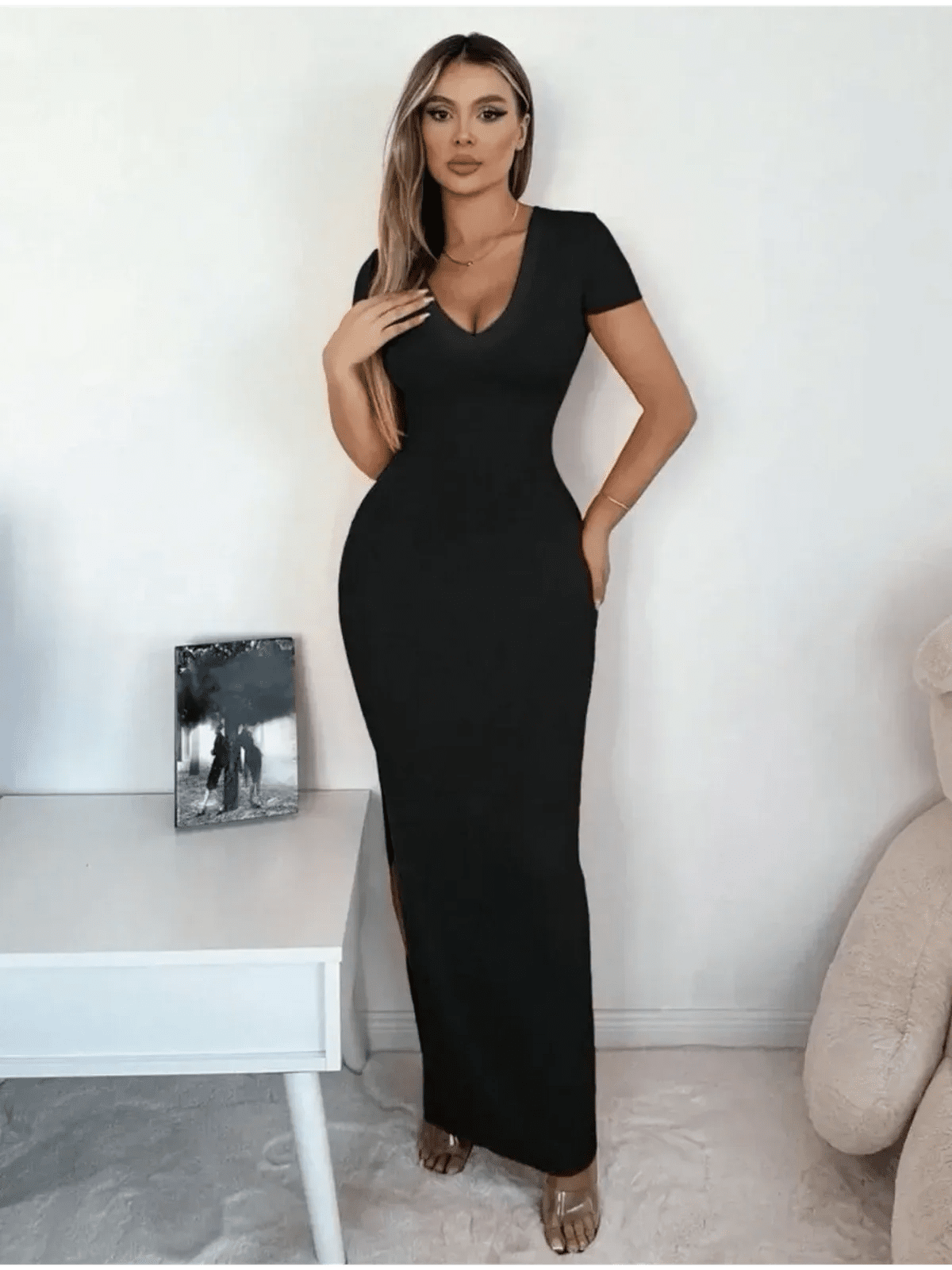 Sleek black Sculpted Elegance Maxi Dress with V-neckline, showcasing modern sophistication and chic minimalist design.