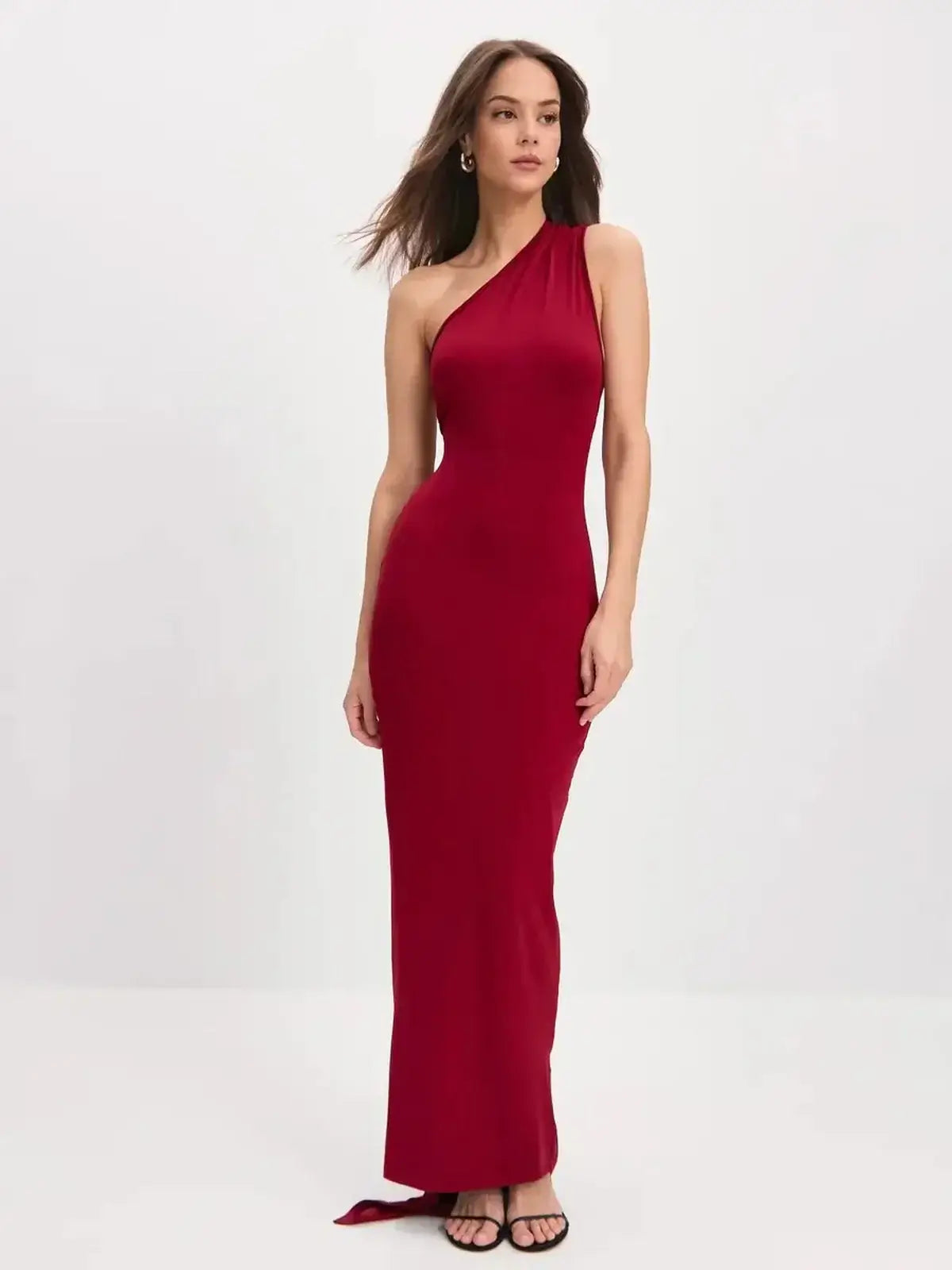One-shoulder sleek red maxi dress with flowing scarf detail, perfect for formal events and summer galas.