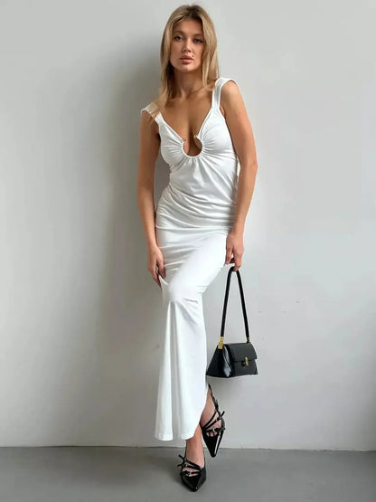 Sculpted Glow Maxi Dress in sleek white with open back, perfect for upscale events and summer soirées.