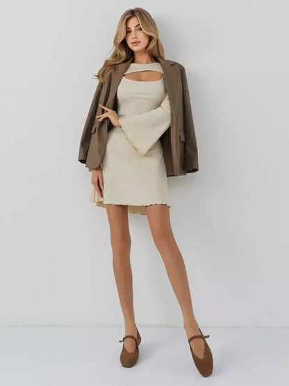 Model showcasing the Sculpted Grace mini dress by Lauven with a refined boat neckline and striking front cutout.