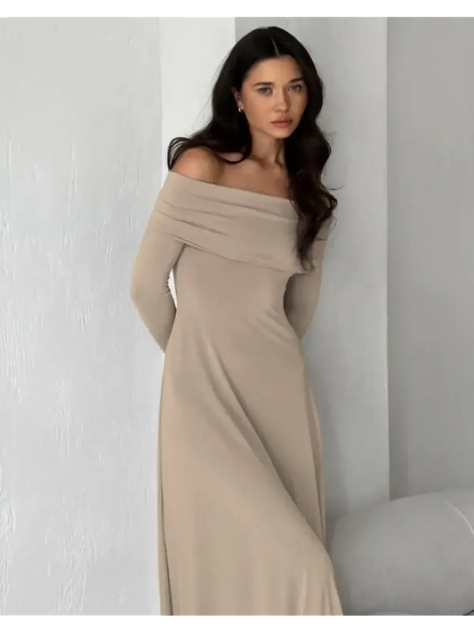 Off-shoulder cappuccino-toned maxi dress showcasing elegant silhouette and body-hugging fabric for refined comfort.
