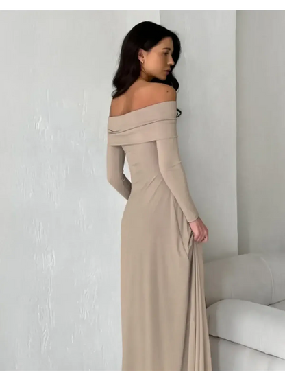 Model showcasing the Sculpted Grace Maxi Dress in cappuccino, featuring an elegant off-shoulder design and sleek silhouette.
