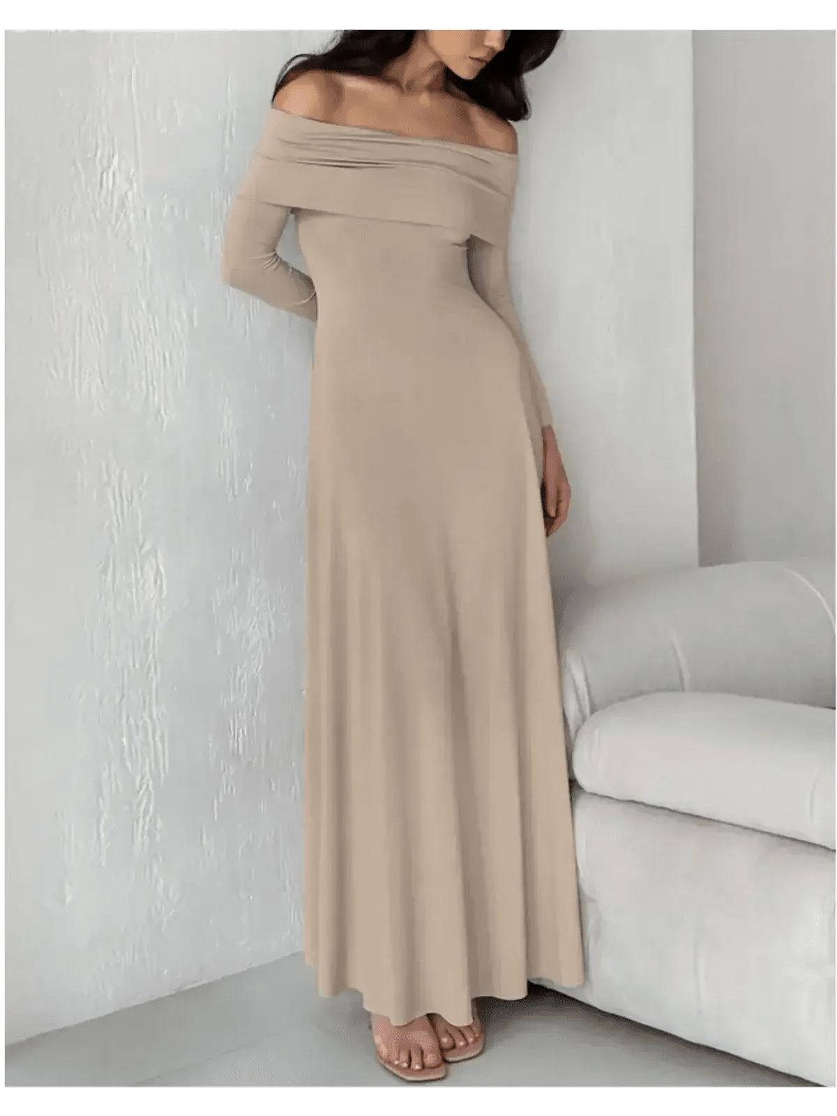 Model wearing a cappuccino-toned off-shoulder maxi dress, showcasing its elegant and sculpting fit.