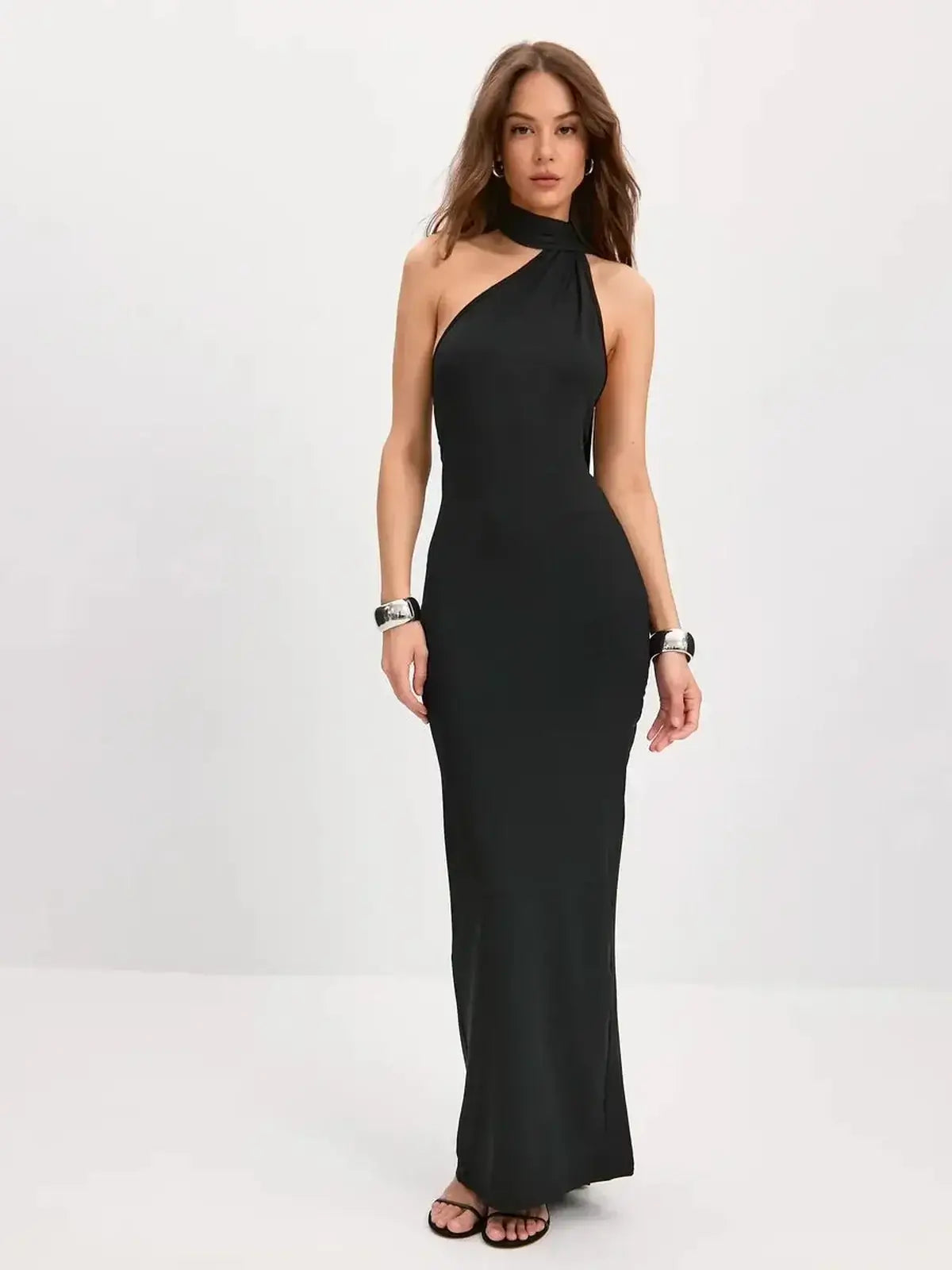 Sculpted Grace Maxi Dress featuring a sleek one-shoulder silhouette and elegant scarf-tie detail in black.