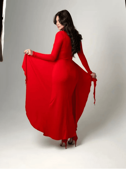 Model showcasing the Sculpted Grace Maxi Dress in red, featuring luxe draping and a flattering silhouette.