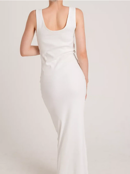 Back view of the Sculptura Maxi Dress, showcasing its sleek ribbed design and elegant silhouette in white.