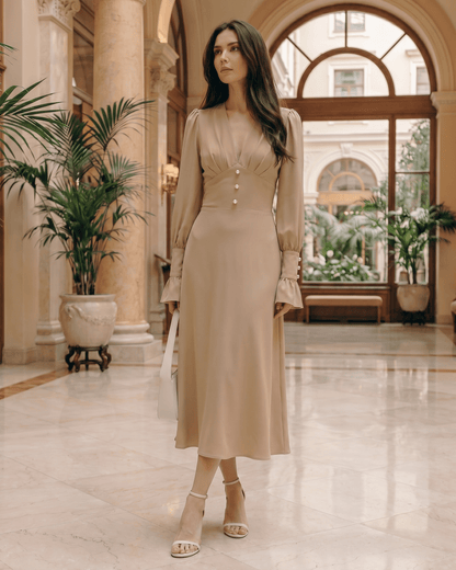 Selene Midi Dress in beige, featuring a deep V-neck, long lantern sleeves, and a polished silhouette by Lauven.
