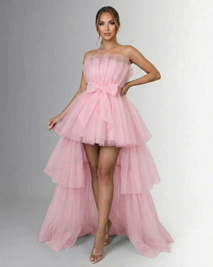 Seraphina Maxi Dress by Lauven, elegant pink tulle strapless gown with high-low design and bow embellishment.