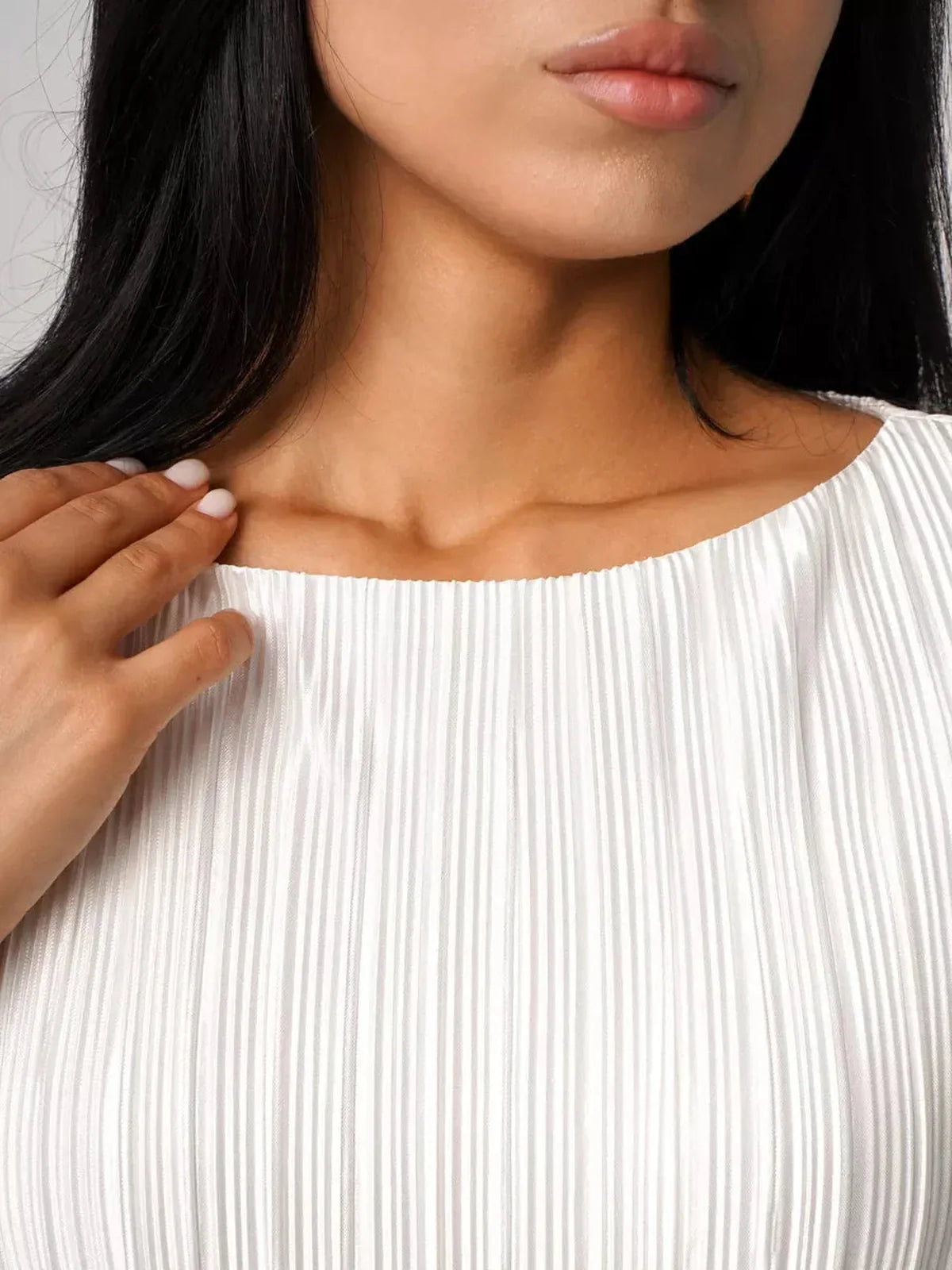 Close-up of the Seraphine Maxi Dress neckline, highlighting elegant pleating and refined silhouette.