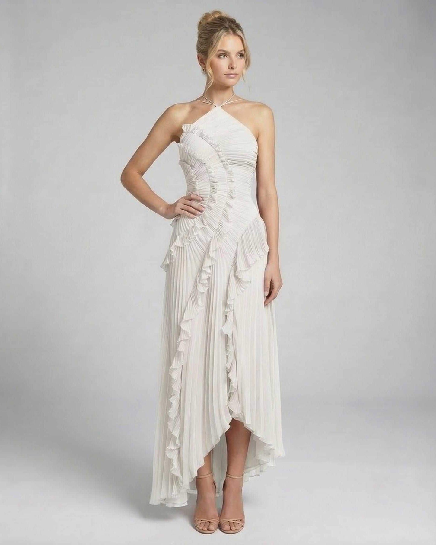 Seren Maxi Dress by Lauven - Classic ivory pleated halter gown with ruffles and high-low silhouette.