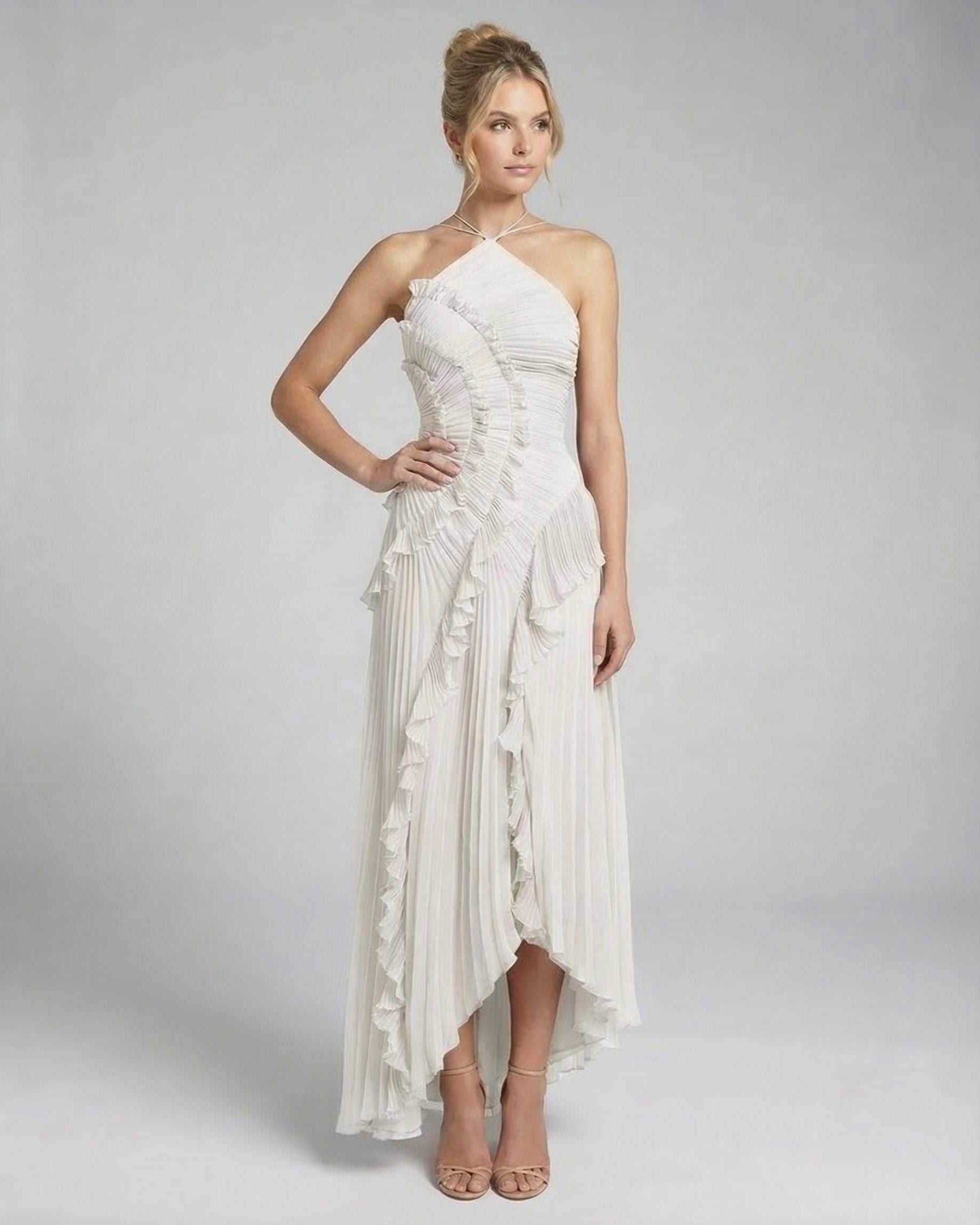Seren Maxi Dress by Lauven - Classic ivory pleated halter gown with ruffles and high-low silhouette.