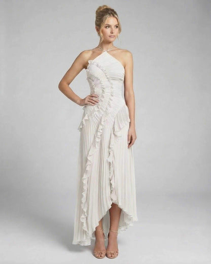 Seren Maxi Dress by Lauven - Classic ivory pleated halter gown with ruffles and high-low silhouette.