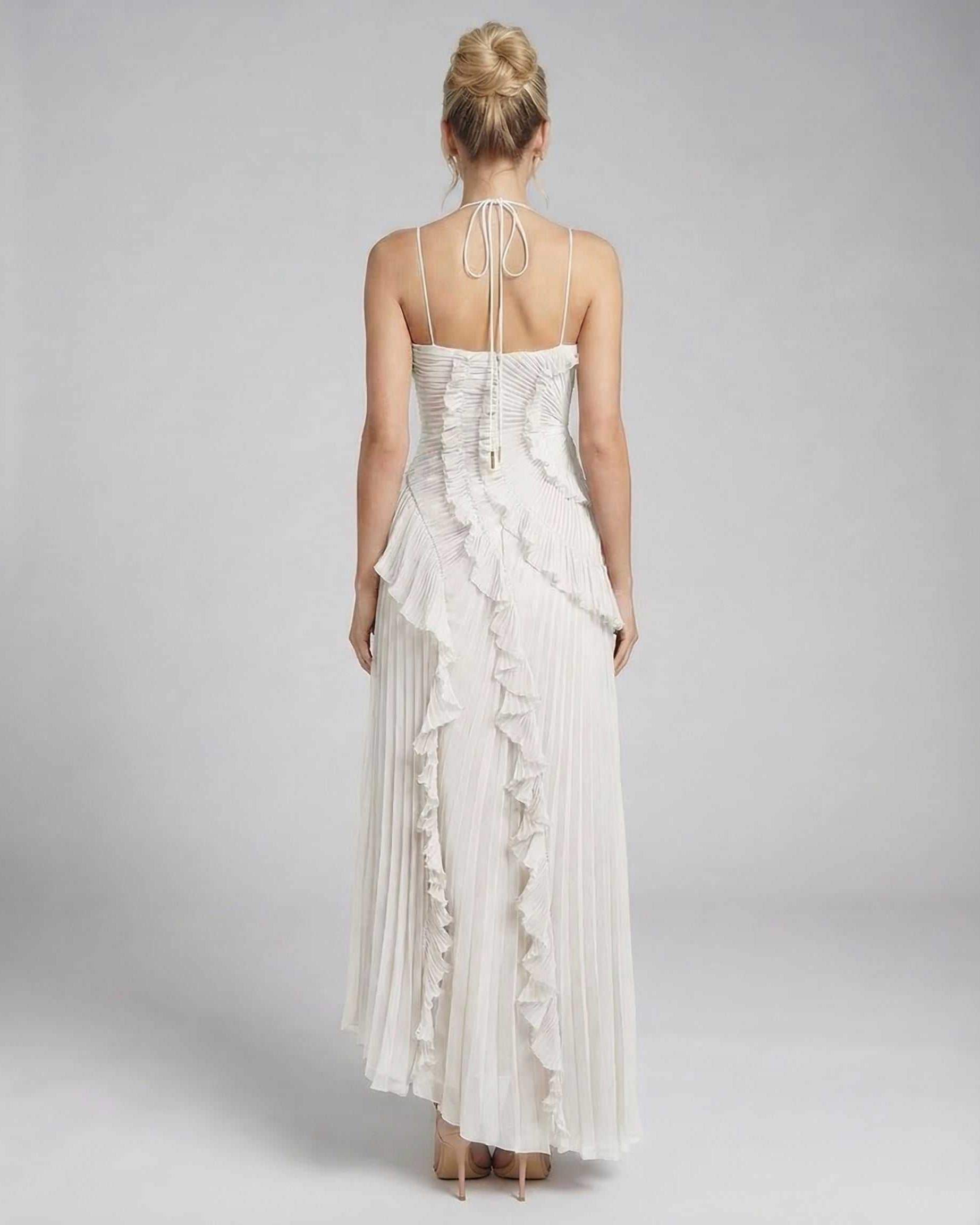 Back view of Seren Maxi Dress by Lauven, showcasing delicate ruffle accents and pleated fabric in classic ivory.