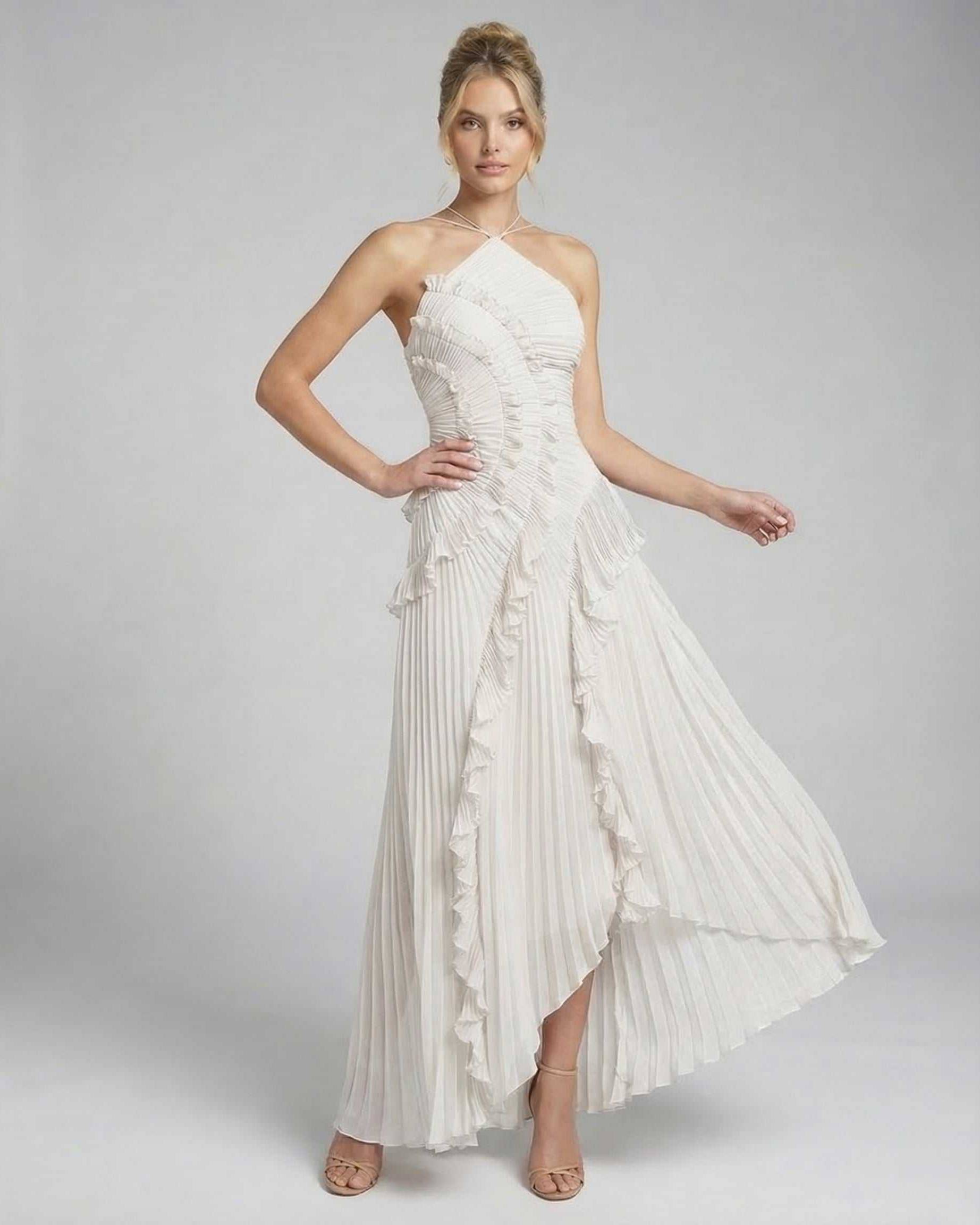 Seren Maxi Dress by Lauven in classic ivory with pleated fabric and halter neckline, showcasing graceful ruffle accents.