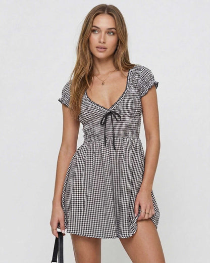 Seren Mini Dress by Lauven featuring elegant gingham check, V-neck, and empire waist design.