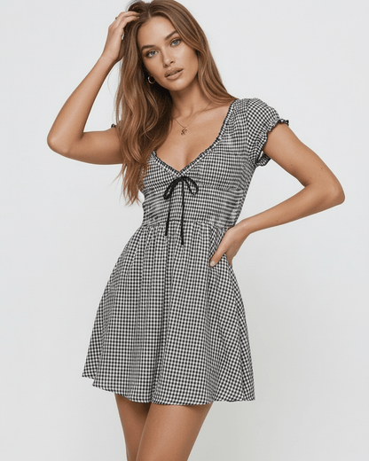 Seren Mini Dress by Lauven featuring elegant gingham check, V-neck, and empire waist design.