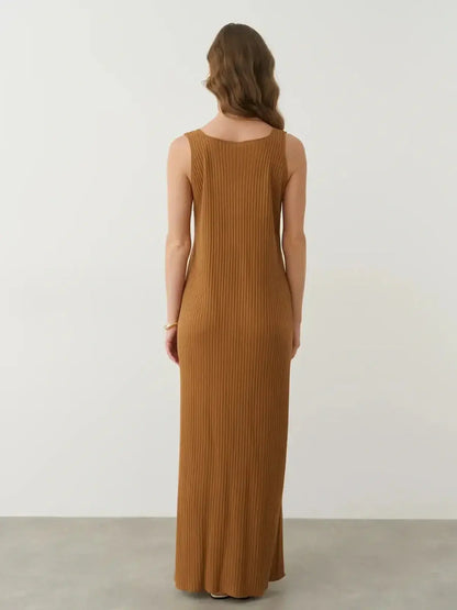 Back view of the Serena Maxi Dress featuring a sleeveless ribbed design in warm brown, perfect for elegant and casual styling.