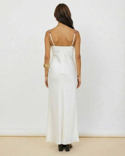 Back view of the Serena Maxi Dress by Lauven, showcasing white satin fabric and floral embroidery details.