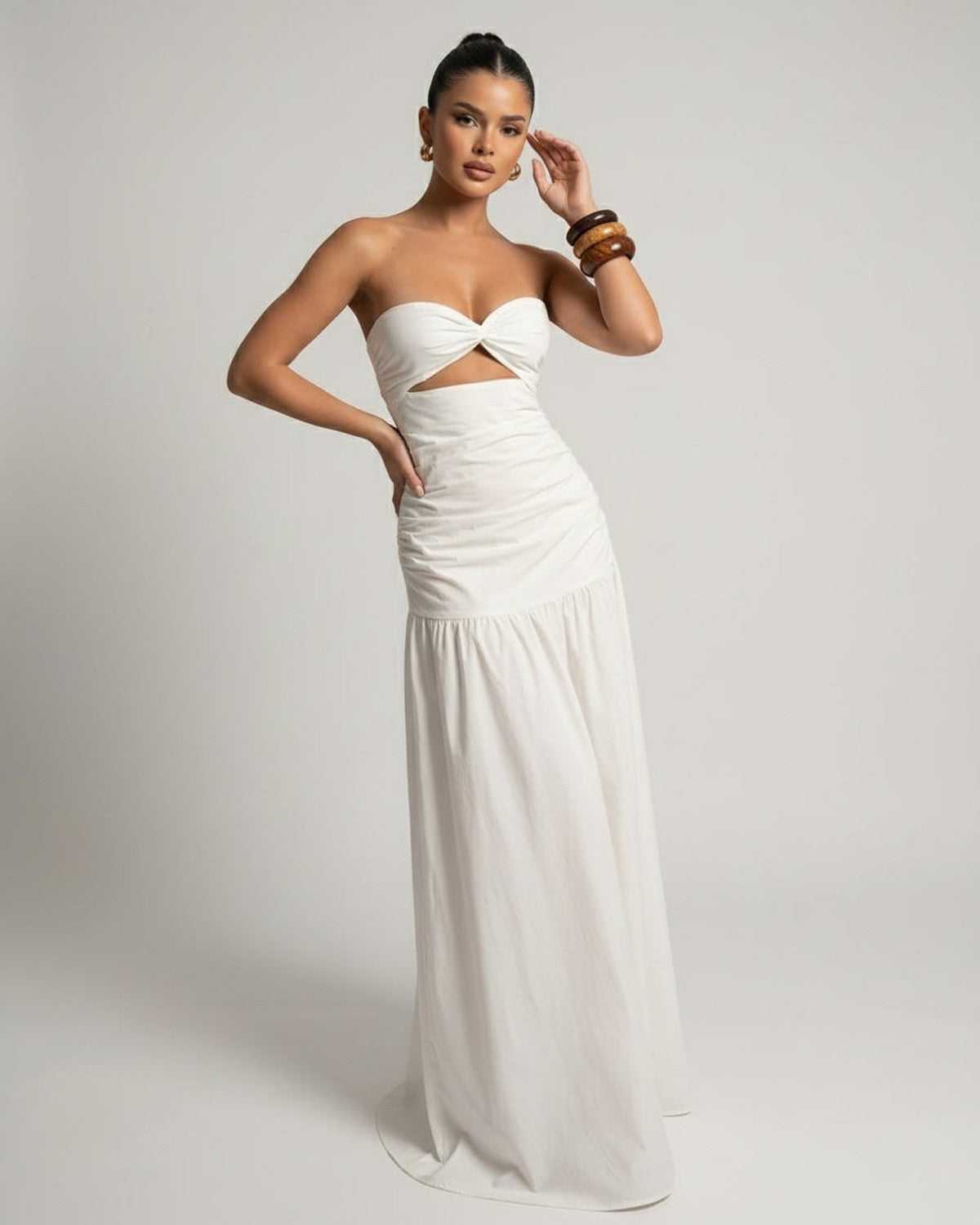Serena Maxi Dress featuring a strapless design, cutout high waist, and flowing silhouette by Lauven.