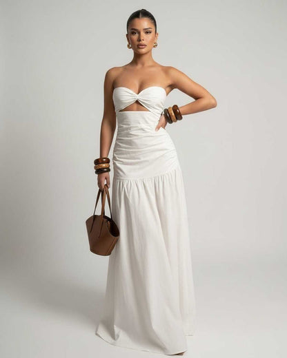 Serena Maxi Dress featuring a white strapless design, high waist cutout, and flowing silhouette from Lauven.