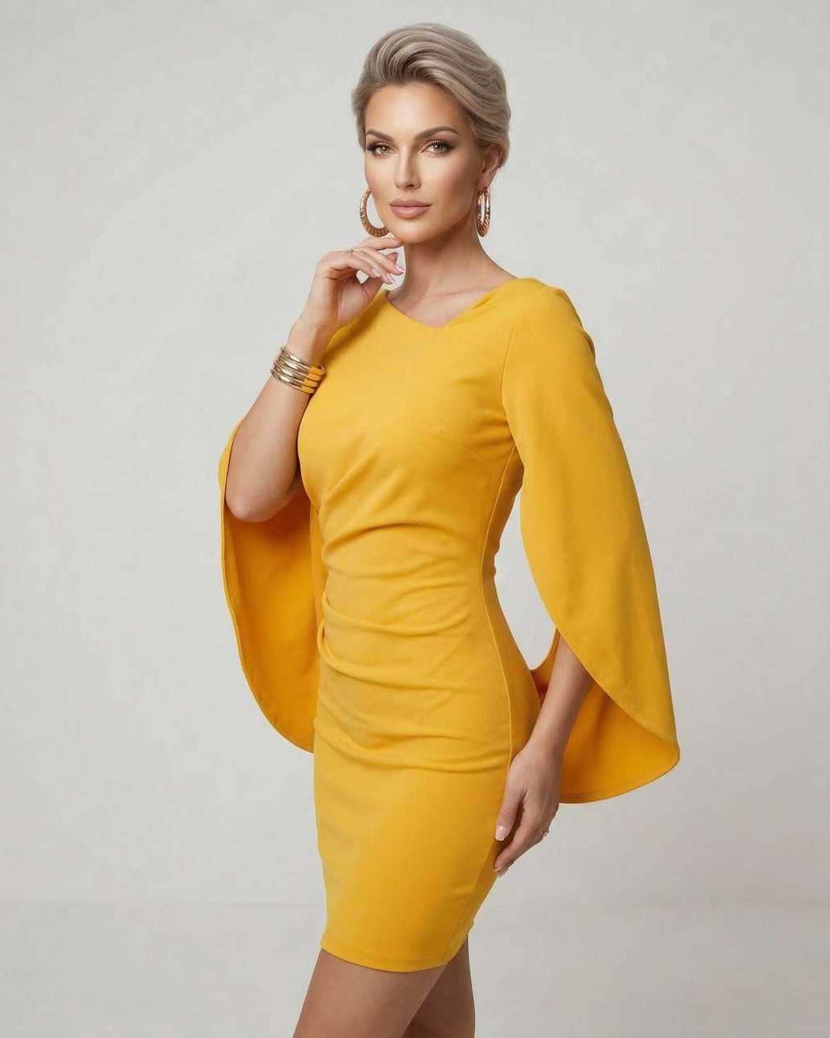 Serena Mini Dress by Lauven featuring yellow cloak sleeves and a flattering sheath silhouette.