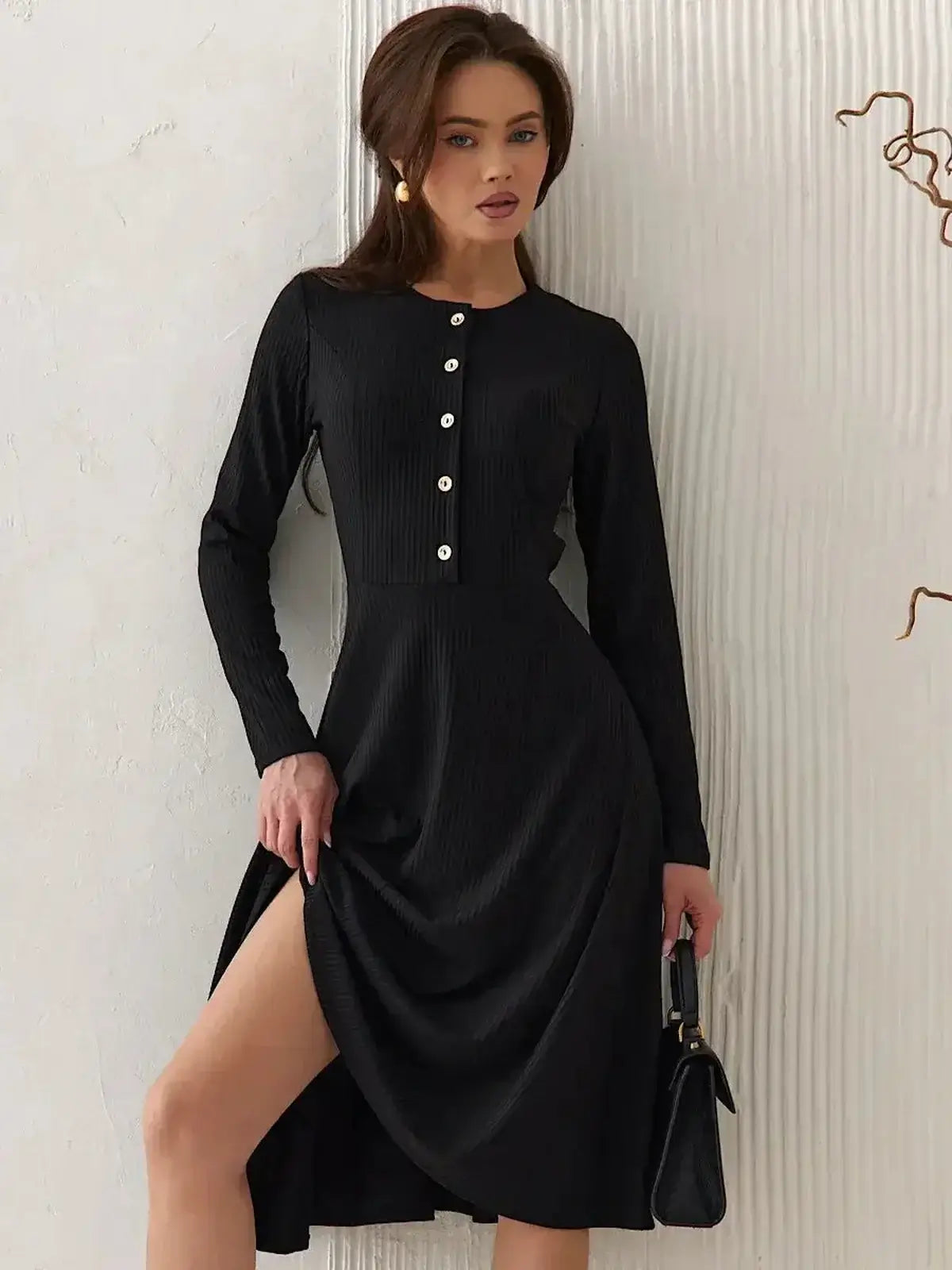 Serene Grace Midi Dress by Lauven featuring a black ribbed silhouette and decorative buttons for elegance.