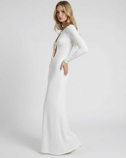 Serene Maxi Dress by Lauven, showcasing textured white fabric with elegant hollow-out details and a slim fit silhouette.