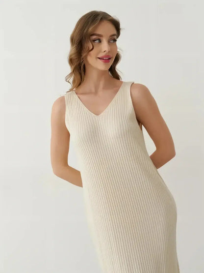 Model showcasing the Serene Rib Maxi Dress in soft knit with a V-neckline, perfect for summer styling.