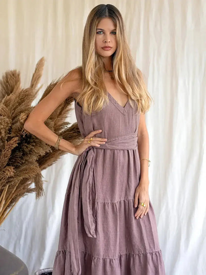 Model wearing the Sienna Breeze Maxi Dress, showcasing its tiered design and rich mocha hue.