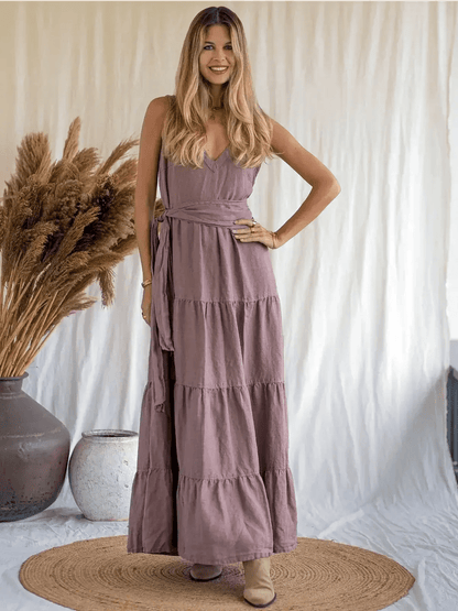 Woman wearing Sienna Breeze Maxi Dress in mocha, showcasing a relaxed A-line silhouette and tiered design.