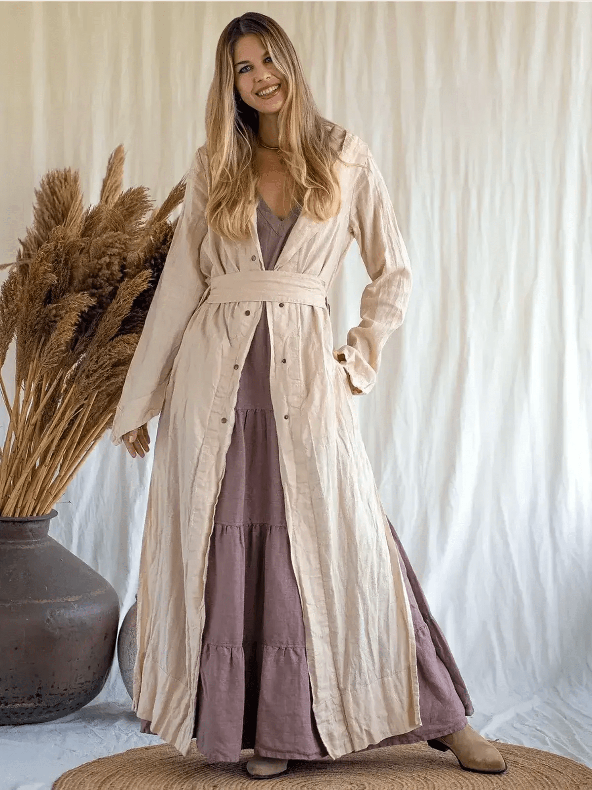Model wearing Sienna Breeze Maxi Dress, a tiered linen summer dress with a self-tie belt and rich mocha hue.