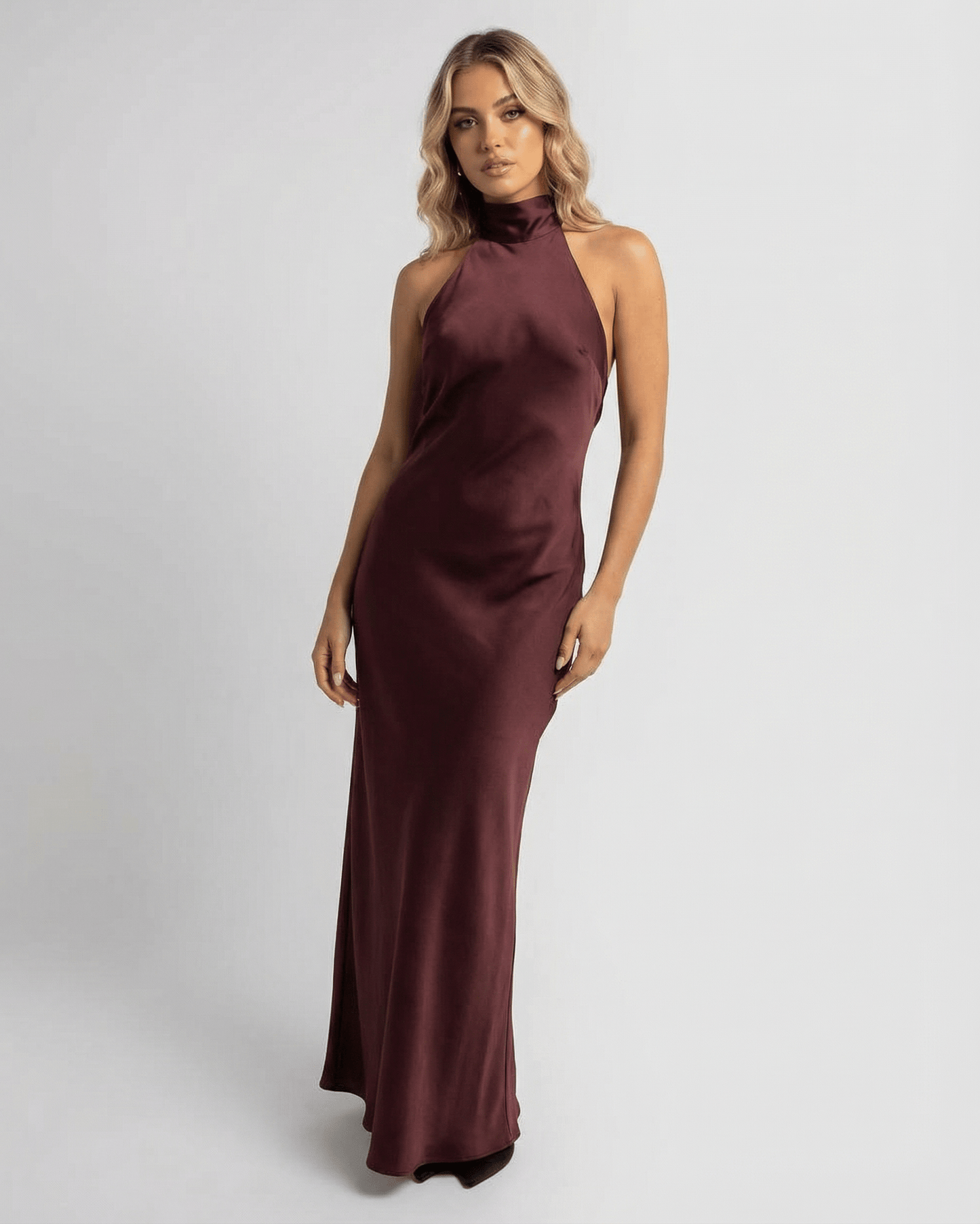 Sienna Maxi Dress by Lauven in burgundy satin with sleek sheath silhouette and halter neckline.