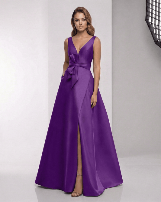 Sienna Maxi Dress in purple satin with wrap slit, bow waist, and elegant A-line silhouette by Lauven.