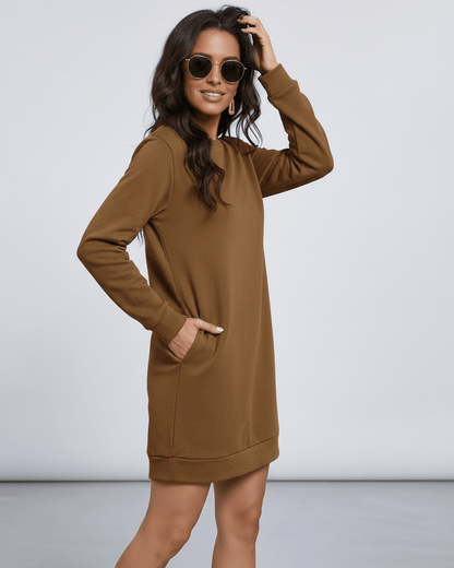 Model wearing Sienna Mini Dress by Lauven in brown, showing pockets and relaxed fit for casual style.