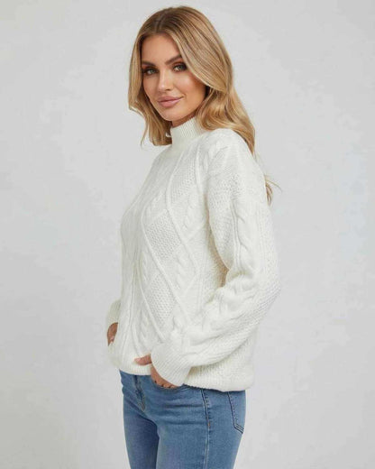 Women wearing the Sienna Sweater by Lauven, featuring an oversized cable knit design in white.