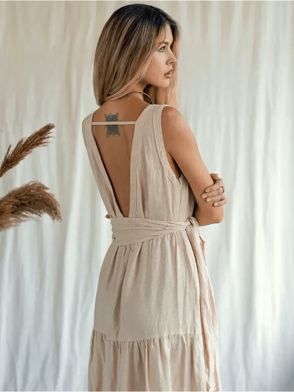 Sierra Maxi Dress featuring a stylish V-neckline and self-tie belt, showcasing its airy linen fabric and boho charm.