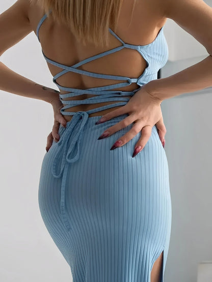 Back view of the Sky Lace Midi Dress showcasing its open corset design and ribbed bodycon fit.